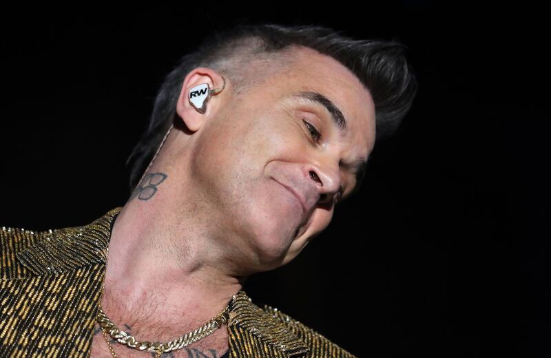 Robbie Williams delivered an almost chronological greatest hits set.