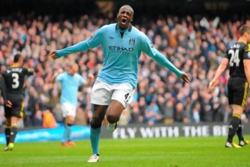 Manchester City's Ivorian midfielder Yaya Toure celebrates scoring the opening goal for Manchester City. 'Yaya can p lay in every position' says his manager, Roberto Mancini.