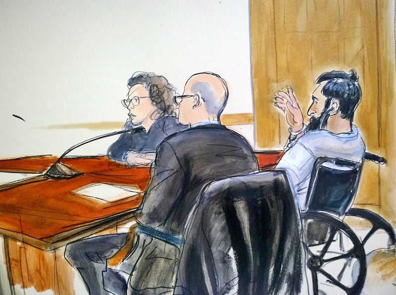 In this courtroom drawing, defendant Sayfullo Saipov, right, addresses the court during his arraignment on federal terrorism charges, Wednesday, Nov. 1, 2017, at Manhattan Federal Court in New York. The Uzbek immigrant is charged for the Oct. 31, truck rampage on a New York City bike path that left eight people dead. Saipov said he was spurred to attack by the Islamic State group's online calls to action and picked Halloween because he knew more people would be out on the streets. Seated at the defense table federal defenders David Patton and Sylvie Levine. (Elizabeth Williams via AP)
