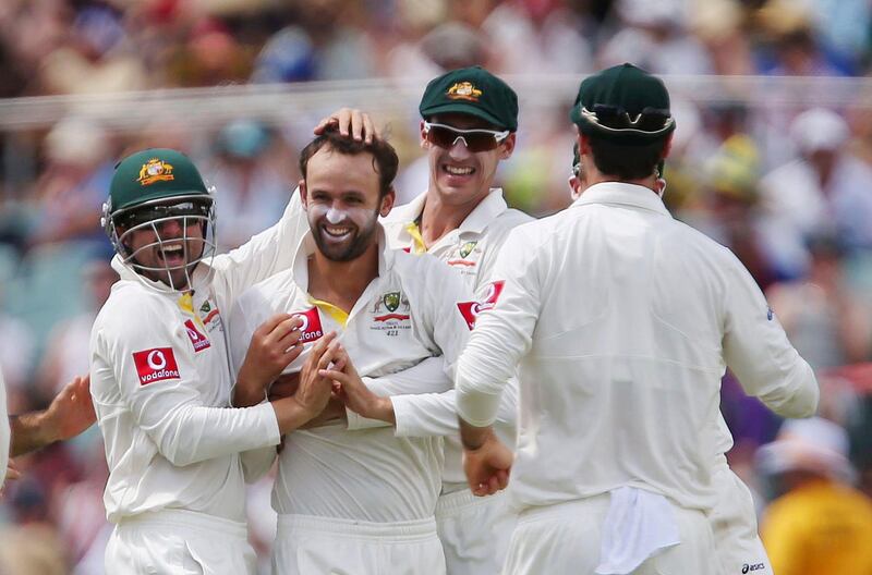 Team mates congratulate Australia's Nathan Lyon (2nd L) after he took the wicket of South Africa's Hashim Amla during the fourth day's play of their second cricket test match at the Adelaide cricket ground November 25, 2012.    REUTERS/Regi Varghese (AUSTRALIA - Tags: SPORT CRICKET) *** Local Caption ***  SYD20_CRICKET-SAFRI_1125_11.JPG