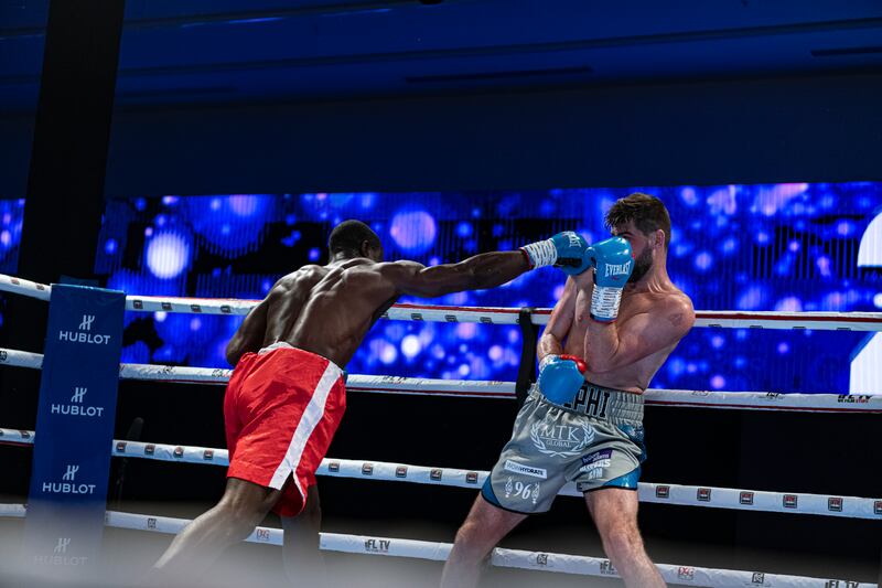 Rocky Fielding, right, defends against Emmanuel Danso.