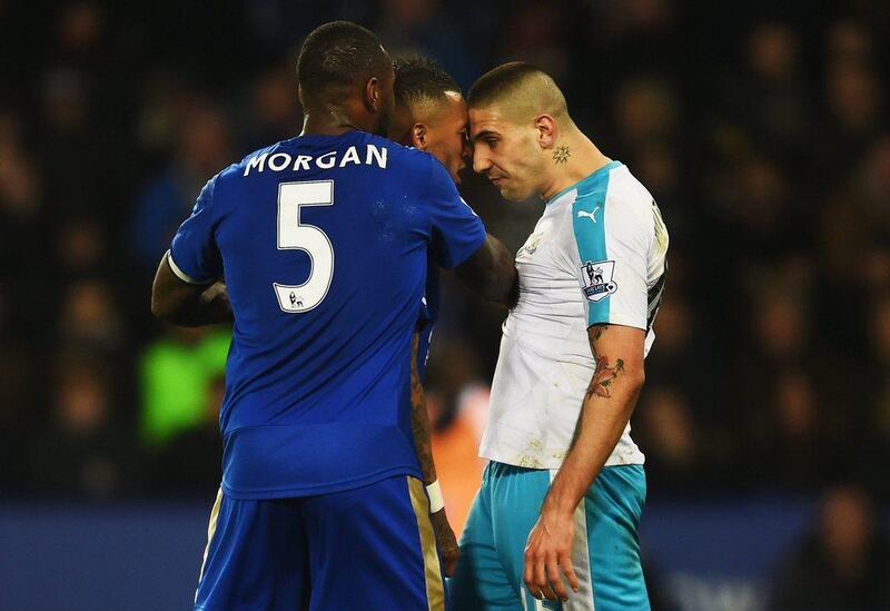 Aleksandar Mitrovic of Newcastle United and Danny Simpson of Leicester City clash as Wes Morgan of Leicester City (5) intervenes during the Premier League match between Leicester City and Newcastle United at The King Power Stadium on March 14, 2016 in Leicester, England. (Photo by Laurence Griffiths/Getty Images)