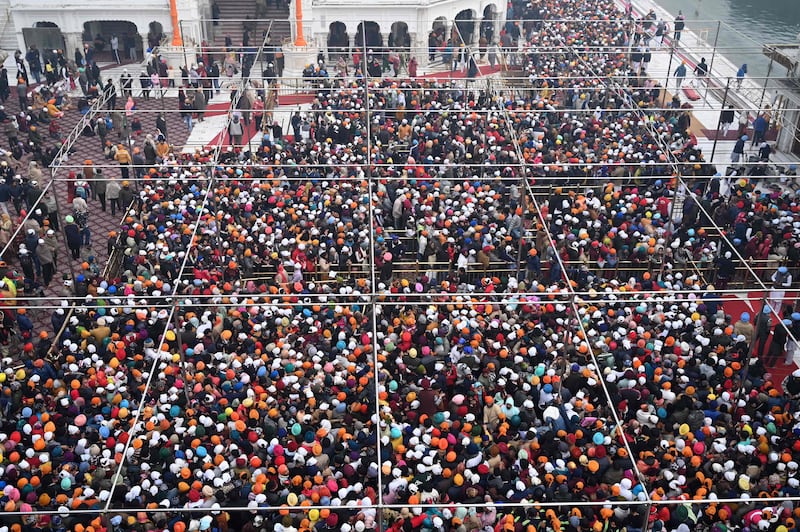 Devotees crowd to visit the Golden Temple in Amritsar on New Year's Day. AFP
