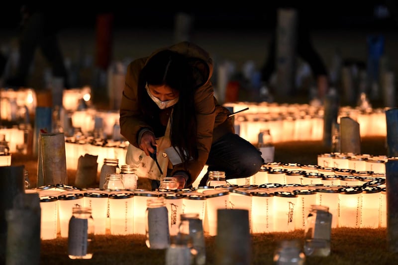 Lit candles are arranged to spell out "memory" and "connecting future" at the Great East Japan Earthquake and Nuclear Disaster Memorial Museum in Futaba, Fukushima Prefecture. AFP