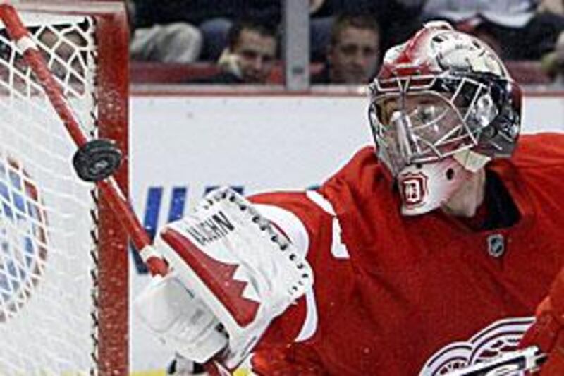 The Red Wings goalie Jimmy Howard deflects a shot during 2-0 loss to the Atlanta Thrashers.