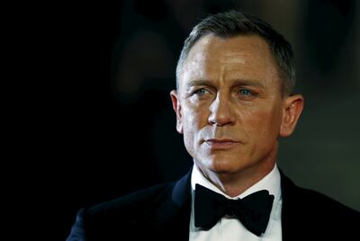 FILE PHOTO: Daniel Craig poses for photographers as he attends the world premiere of the new James Bond 007 film "Spectre" at the Royal Albert Hall in London, Britain, October 26, 2015. REUTERS/Luke MacGregor/File Photo