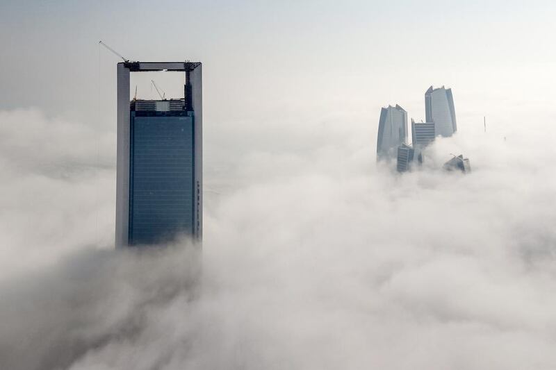 Fog surrounds the Etihad Towers and Adnoc building in Abu Dhabi on January 3, 2015. Courtesy Ainhoa Sanchez / Volvo Ocean Race