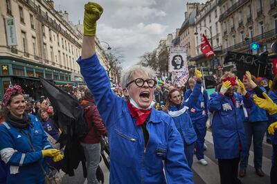 PARIS, FRANCE - MARCH 03: Protestors dressed as the icon Rosie the Riveter chant in protest to the French Government's pension reform bill during demonstrations in response to French Prime Minister Edouard Philippe enacting article 49.3 of the constitution to force through the pension reform bill in the National Assembly on March 03, 2020 in Paris, France. The bill merges 42 different pension schemes into a single, points-based system, to have everyone in France retire at the same time, and is largely opposed by French Unions and follows months of strikes and protests. (Photo by Kiran Ridley/Getty Images)