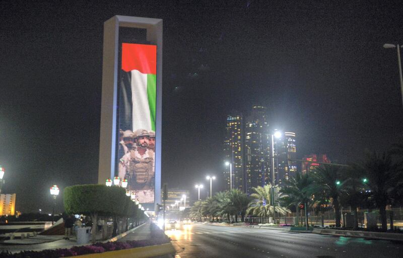 Abu Dhabi, United Arab Emirates - ADNOC building projected with the image of Sheikh Zayed Bin Hamdan on February 17, 2018. (Khushnum Bhandari/ The National)
