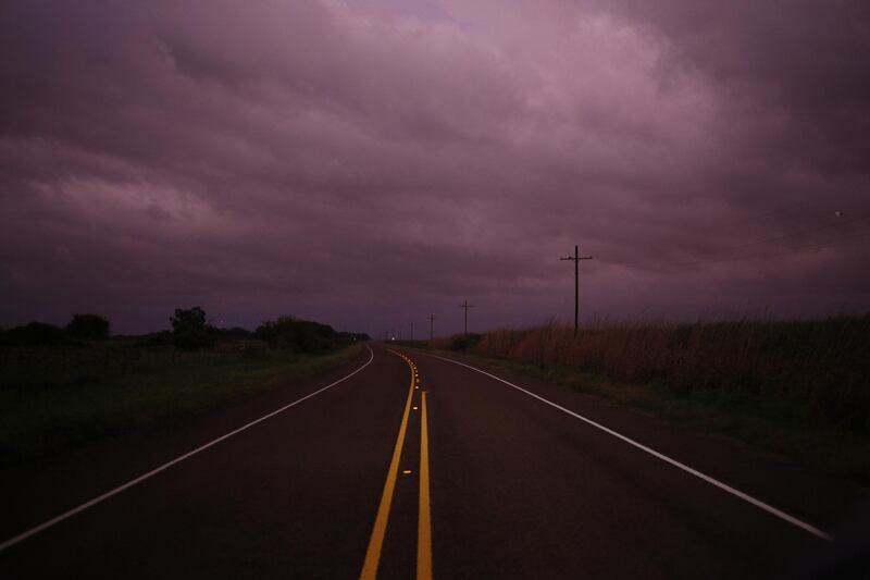 Clouds gather over a street ahead of Hurricane Laura in Sabine, Texas, US.  Bloomberg