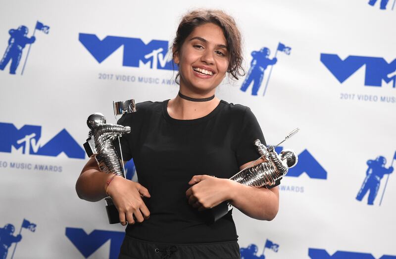 Alessia Cara poses in the press room with the awards for best dance video for Stay and for best fight against the system for Scars To Your Beautiful. Jordan Strauss / Invision / AP