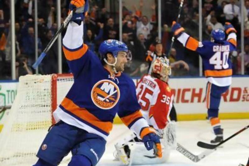 Colin McDonald, left, and the New York Islanders are enjoying a late-season surge. Kathy Kmonicek / AP Photo