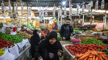 Customers shop at Al Azhar food market Cairo. Bloomberg