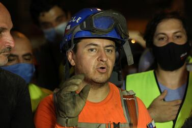Francisco Lermanda, a member of the Chilean team, after digging through the rubble of buildings which collapsed. Reuters
