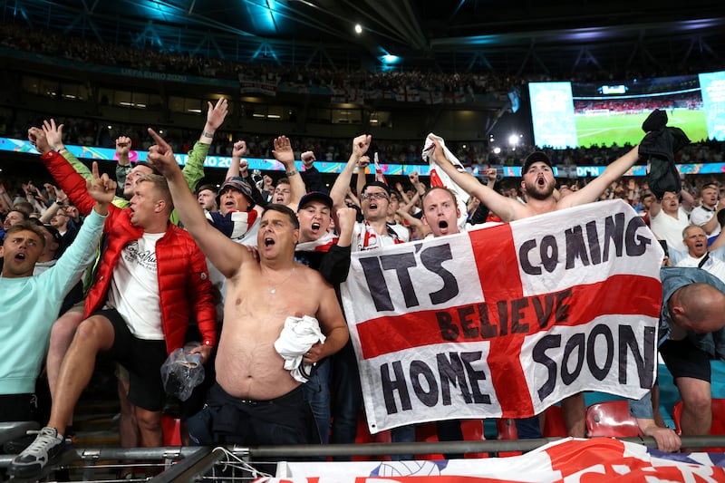 England fans celebrate after the match at Wembley.
