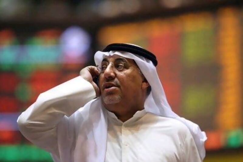 Hits Telecom of Kuwait has a dual listing on the Kuwait Stock Exchange and the Dubai Financial Market. Yasser al Zayyat / AFP