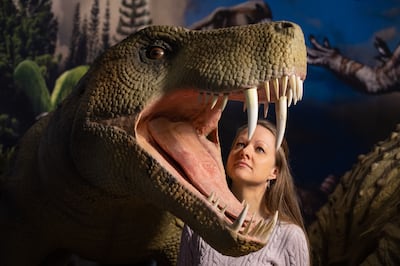 Palaeontologist Dr Emma Nicholls views an animatronic model of a Inostrancevia, a sabre-toothed predator.