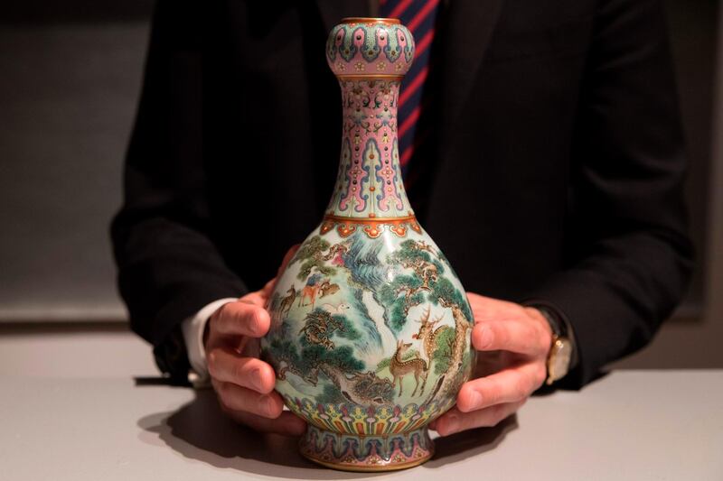(FILES) In this file photo taken on May 22, 2018 a rare Imperial Qianlong porcelain vase (18th century) is displayed at Sotheby's auction company in Paris.  An 18th-century Chinese vase forgotten for decades in a shoe box in a French attic has been sold for 16.2 million euros ($19 million) at Sotheby's in Paris on June 12, 2018 -- more than 30 times the estimate. / AFP / Thomas SAMSON
