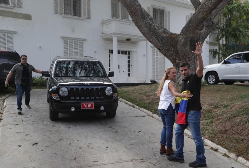Leopoldo Lopez and his wife Lilian Tintori outside the Spanish ambassador's residence in Caracas, where they have taken refuge after a failed uprising launched on April 30, 2019.  EPA