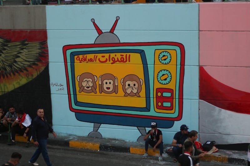 A mural that reads 'Iraqi Channels' in an underspass in Saadoun Street, leading to Tahrir Square. Pesha Magid