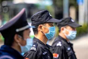 Police and medical workers stop vehicles on the highway road blockade for a health check in Guangzhou, China. The outbreak, which originated in the Chinese city of Wuhan, has so far killed at least 1,874 people and infected over 73,000 others worldwide, mostly in China.