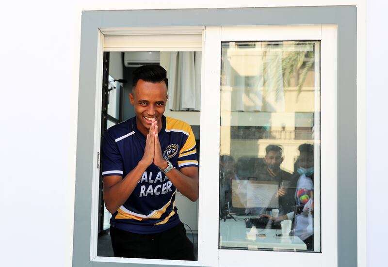 AboFlah greets his fans from the glass box.