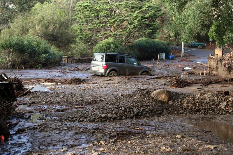 A car is trapped in a mudslide following heavy rains in Montecito, California. Mike Nelson / EPA