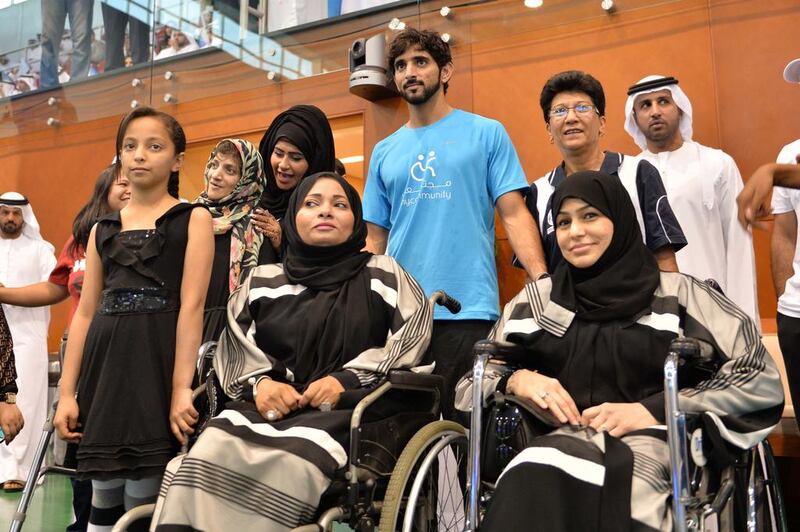 Sheikh Hamdan bin Mohammed with some spectators at the Nad Al Sheba Sports Complex in Dubai. (Wam / April 15, 2014)