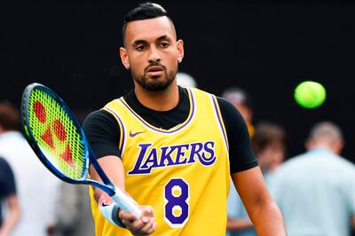 TOPSHOT - Australia's Nick Kyrgios wearing a Los Angeles Lakers jersey with former basketball player Kobe Bryant's number warms up to play against Spain's Rafael Nadal during their men's singles match on day eight of the Australian Open tennis tournament in Melbourne on January 27, 2020. IMAGE RESTRICTED TO EDITORIAL USE - STRICTLY NO COMMERCIAL USE
 / AFP / William WEST / IMAGE RESTRICTED TO EDITORIAL USE - STRICTLY NO COMMERCIAL USE
