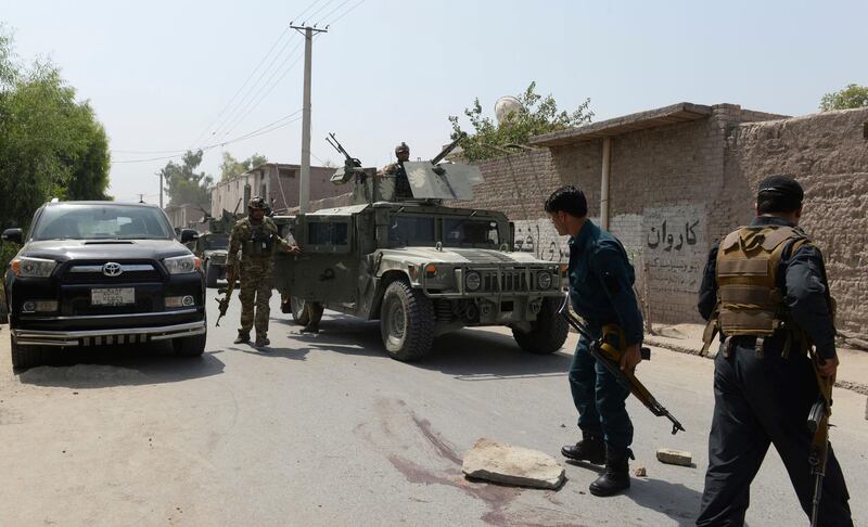 Afghan security forces inspect at the site of a suicide bombing outside an education department building in Jalalabad east of Kabul, Afghanistan, Wednesday, July 11, 2018. At least ten people killed after two suicide bombers stormed an education department building in the eastern Nangarhar province, according to a provincial official. (AP Photo)