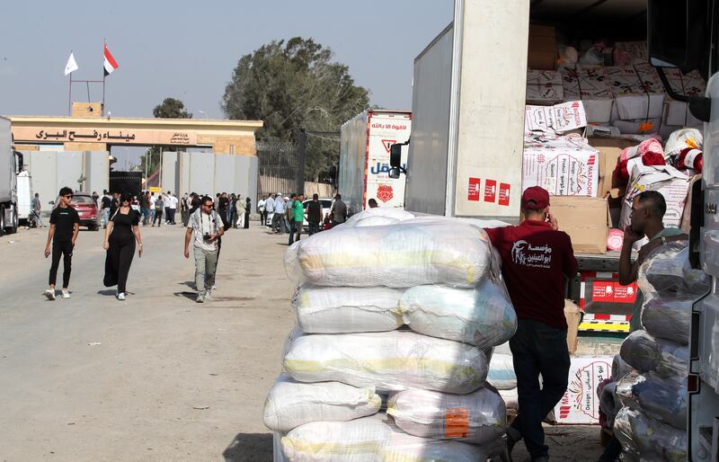 Egyptian volunteers with cargoes of aid bound for Palestinians in the Gaza Strip, at the Rafah border crossing. EPA