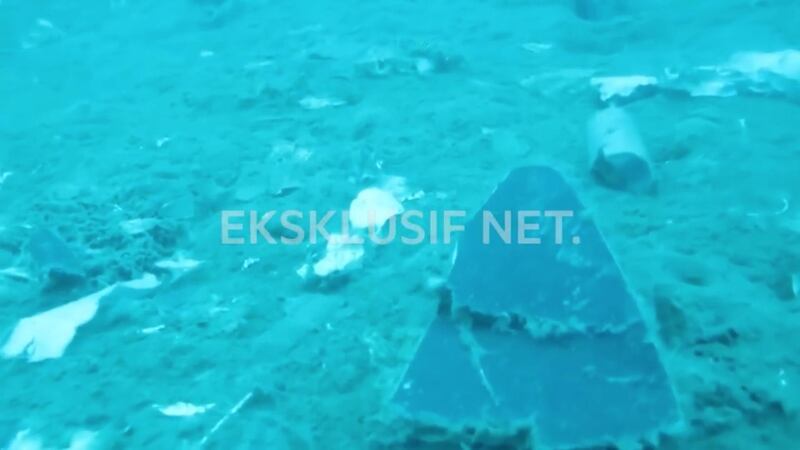 Debris, believed to be from the stricken plane, is seen during an operation by divers near the search area off Tanjung Pakis. Reuters