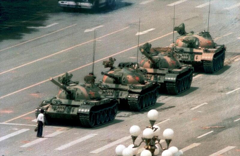 A Chinese man stood alone to block a line of tanks heading east in Beijing's Tiananmen Square on June 5, 1989. The man, calling for an end to the recent violence and bloodshed against pro-democracy demonstrators, was pulled away by bystanders, and the tanks continued on their way. This photo, taken by Jeff Widener of the Associated Press, went on to be nominated for a Pulitzer Prize and is now regarded as one of the most recognisable photographs of all time. Jeff Widener/Associated Press