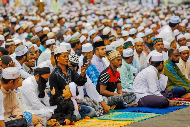 Rohingya Muslims pray on a street during Eid Al Adha celebrations in Kuala Lumpur, Malaysia.  EPA