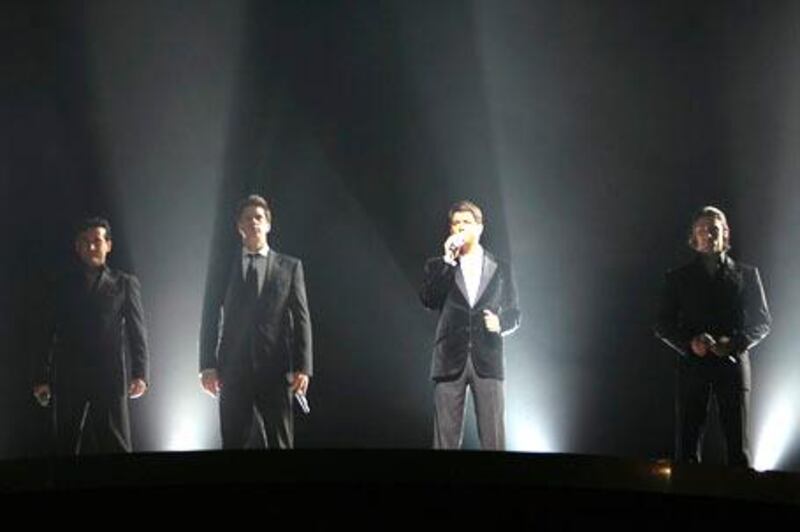 The classical-pop group Il Divo with Carlos Marin of Spain, David Miller of the United States, Sebastien Izambard of France and Urs Buehler of Switzerland, from left to right, performs during a concert at the Hallenstadion in Zurich, Switzerland, Tuesday, June 12, 2007. (AP Photo/KEYSTONE/Eddy Risch)