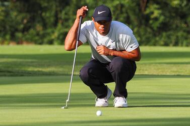 Leader Tiger Woods checks the line for a birdie on the 13th hole during the second round of the PGA Zozo Championship golf tournament in Inzai. AFP