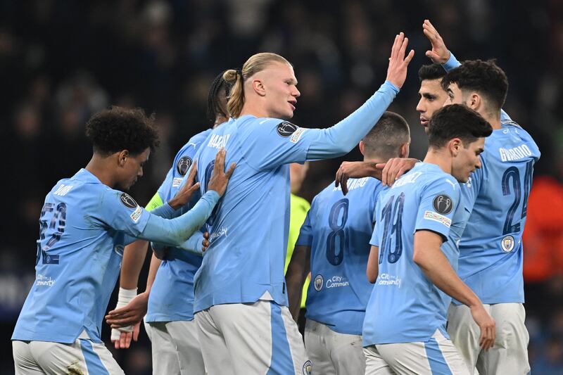 Manchester City's Norwegian striker #09 Erling Haaland (C) celebrates with teammates after scoring their third goal during the UEFA Champions League round of 16, second-leg, football match between Manchester City and FC Copenhagen at the Etihad Stadium, in Manchester, north west England, on March 6, 2024.  (Photo by Paul ELLIS  /  AFP)