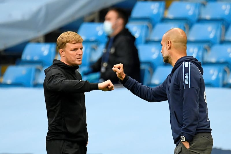 Bournemouth's English manager Eddie Howe (L) touches arms with Manchester City's Spanish manager Pep Guardiola (R) at the end of the game during the English Premier League football match between Manchester City and Bournemouth at the Etihad Stadium in Manchester, north-west England, on July 15, 2020. (Photo by PETER POWELL / POOL / AFP) / RESTRICTED TO EDITORIAL USE. No use with unauthorized audio, video, data, fixture lists, club/league logos or 'live' services. Online in-match use limited to 120 images. An additional 40 images may be used in extra time. No video emulation. Social media in-match use limited to 120 images. An additional 40 images may be used in extra time. No use in betting publications, games or single club/league/player publications. / 