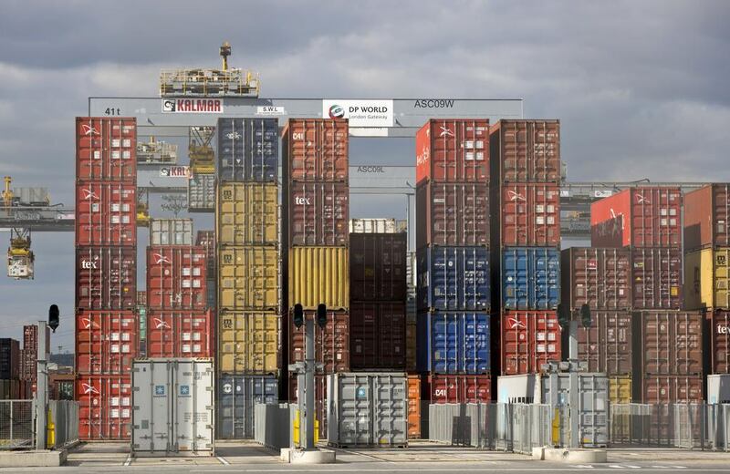Shipping containers sit on the dock. Global trade is showing signs of bouncing back from pandemic-induced slump, however, a complete recovery will take longer as countries battle second and third waves of Covid-19, according to the WTO. AFP