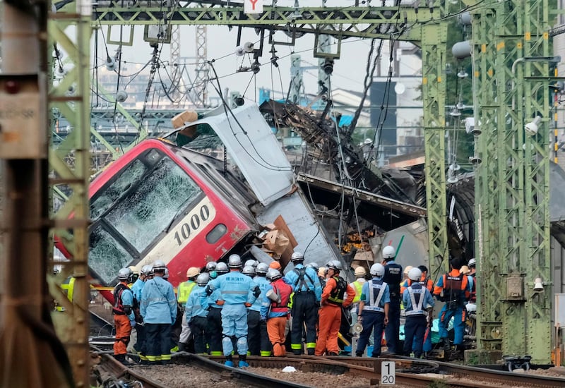 TOPSHOT - A train is seen derailed after a collision with a truck at a crossing in Yokohama, Kanagawa Prefecture on September 5, 2019.
 A train and a truck collided at a crossing near Tokyo, injuring 35 people, with at least one person seriously hurt, authorities said. / AFP / Kazuhiro NOGI
