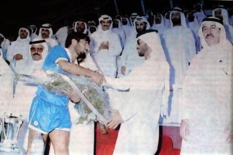 Football Federation President Sheikh Hamdan Bin Zayed Al Nahyan congratulates Abdulrahman Mohammed following Al Nasr's President's Cup win. Al Ittihad