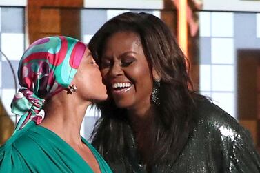 Alicia Keys, left, kisses Michelle Obama at the 61st annual Grammy Awards on February 10. AP