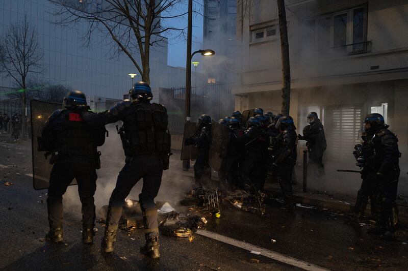 French riot police clash with protesters during a demonstration over the proposed security law in Paris, France. Getty Images