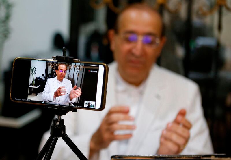 Imad Fawzi Shueibi, 59, professor of epistemology at Damascus University, speaks during an interview with AFP via video call from his home in the Syrian capital Damascus. The coronavirus pandemic could create a new world order in which everyone is a loser and new alliances are born to overcome disaster, according to the Syrian thinker. AFP