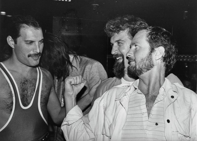 From left to right, singer Freddie Mercury (1946 - 1991) of British rock band Queen with comedian Billy Connolly and DJ Kenny Everett, during Mercury's 38th birthday party at the Xenon nightclub, 1984. (Photo by Dave Hogan/Getty Images)