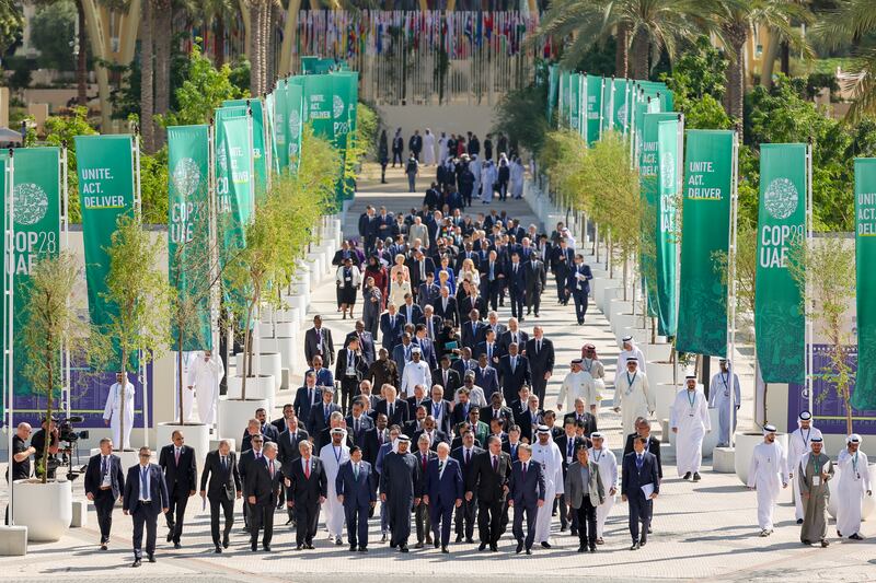 World leaders walk down Al Wasl Avenue after a group photo on day one of Cop28 at Expo City Dubai. Getty Images