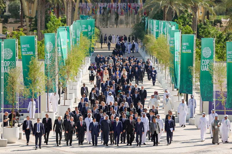 World leaders walk down Al Wasl Avenue after a group photo on day one of Cop28 at Expo City Dubai. Getty Images