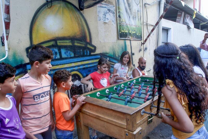 Children play table football at the Bass Palestinian refugee camp in the Lebanese southern coastal city of Tyre. AFP