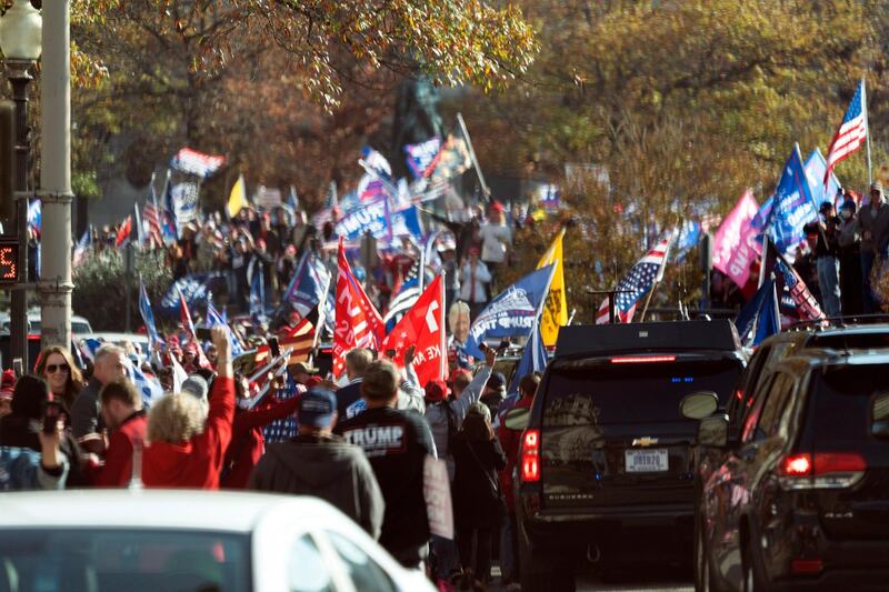 Trump supporters demonstrate as the motorcade carrying U.S. President Donald J. Trump drives through a rally of while departing the White House,  Washington, DC.  EPA