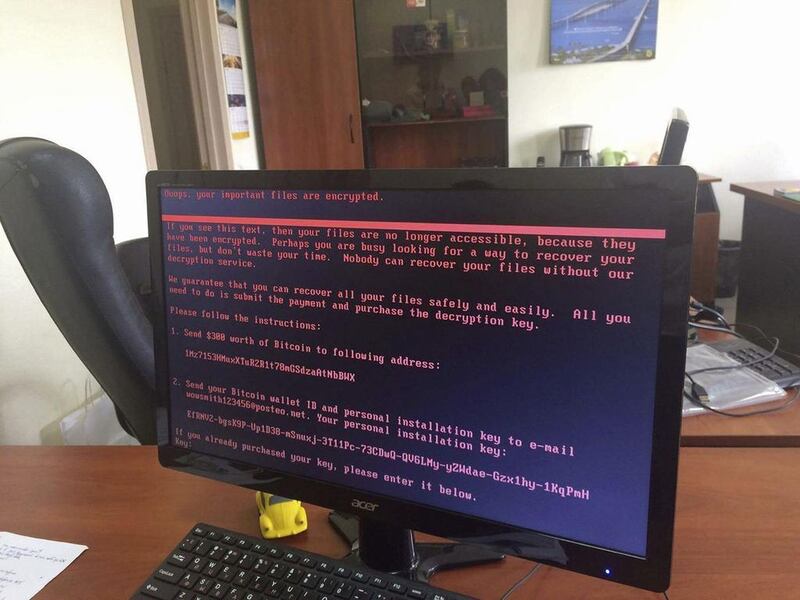 A computer screen cyberattack warning notice reportedly holding computer files to ransom, as part of a massive international cyberattack, at an office in Kiev, Ukraine on June 27, 2017 as a new and highly virulent outbreak of malicious data-scrambling software appears to be causing mass disruption across Europe and the US. Oleg Reshetnyak via AP